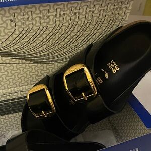 Birkenstock Black Sandals with Shiny Gold Buckles